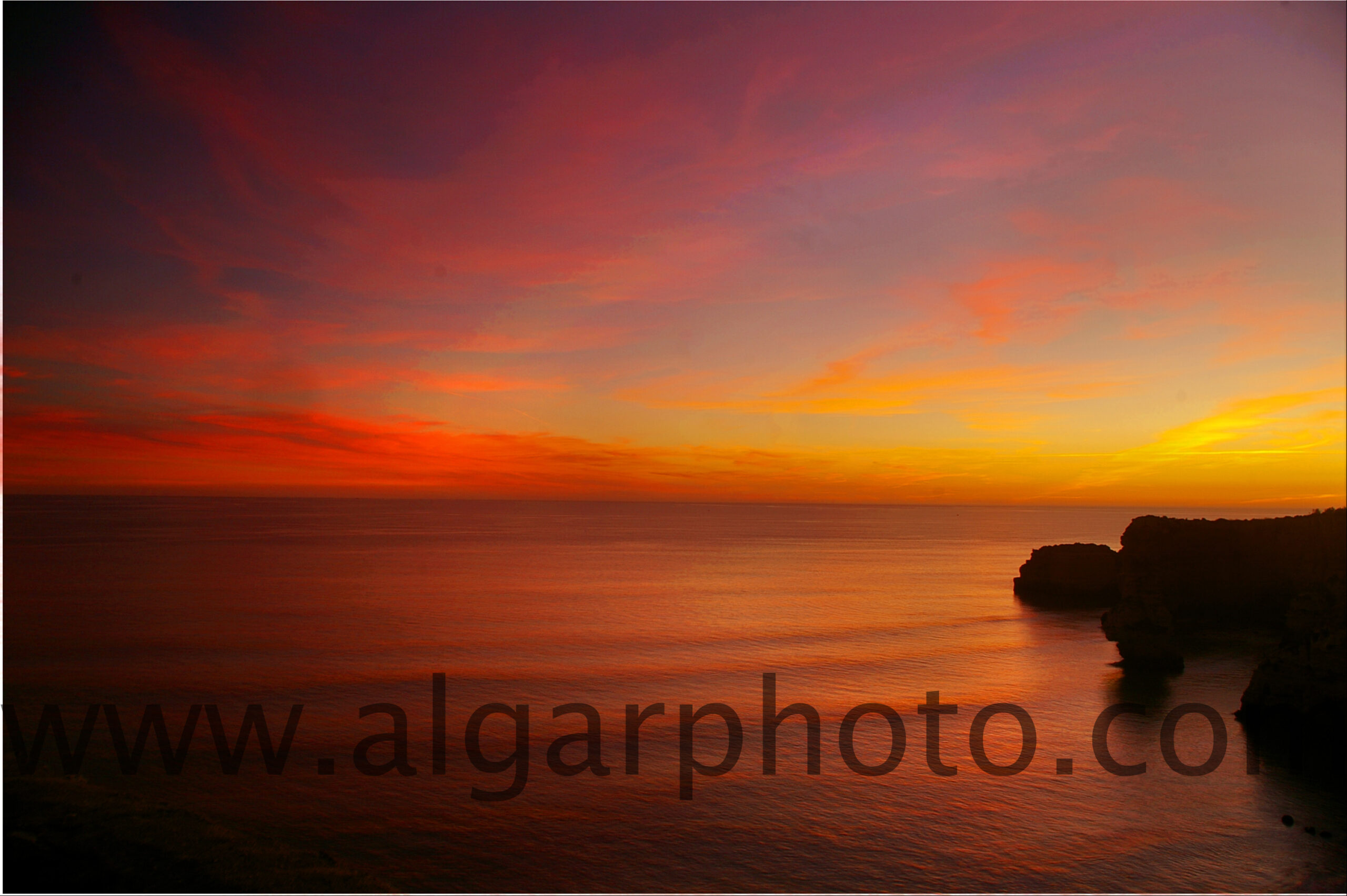 Sunset over Praia da Marinha Algarve Portugal